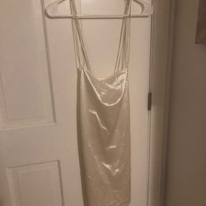 White thigh-length dress from H&M. Size medium. Satin-like material.